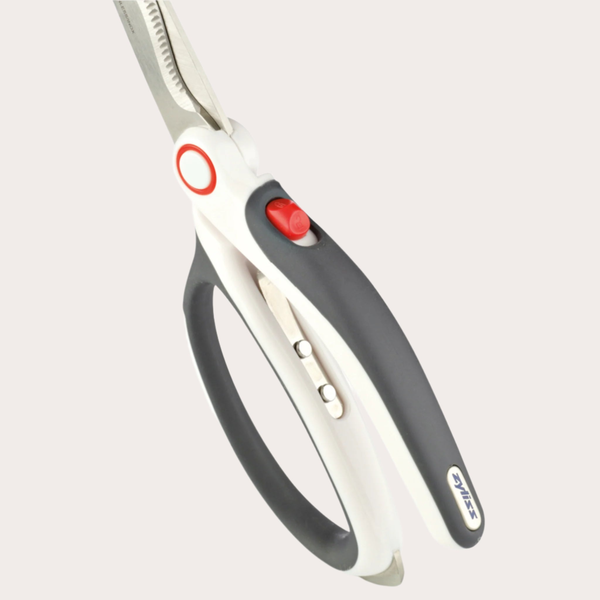The Zyliss All Purpose Shears boast stainless steel blades, a serrated edge, and are available in gray and white. Equipped with a red safety lock, ergonomic handles, and a built-in nutcracker, theyre the ultimate tool for any kitchen task.