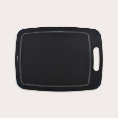 The Zyliss Wood Fibre Cutting Board, black and rectangular with a handle and rounded corners, made from recycled wood fibres, is shown on a light background. #Large