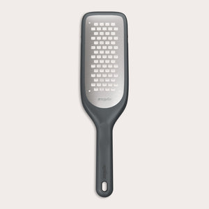 The Zyliss Coarse Grater is a black and silver foot file with a long handle and ultra-sharp grater surface, designed to efficiently remove dead skin from feet.
