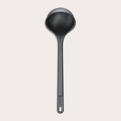 A Zyliss Ladle, black in color with a long handle and deep, rounded bowl for ergonomic use, is shown against a plain light background. #Large