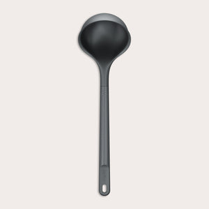 A Zyliss Ladle, black in color with a long handle and deep, rounded bowl for ergonomic use, is shown against a plain light background. #Large