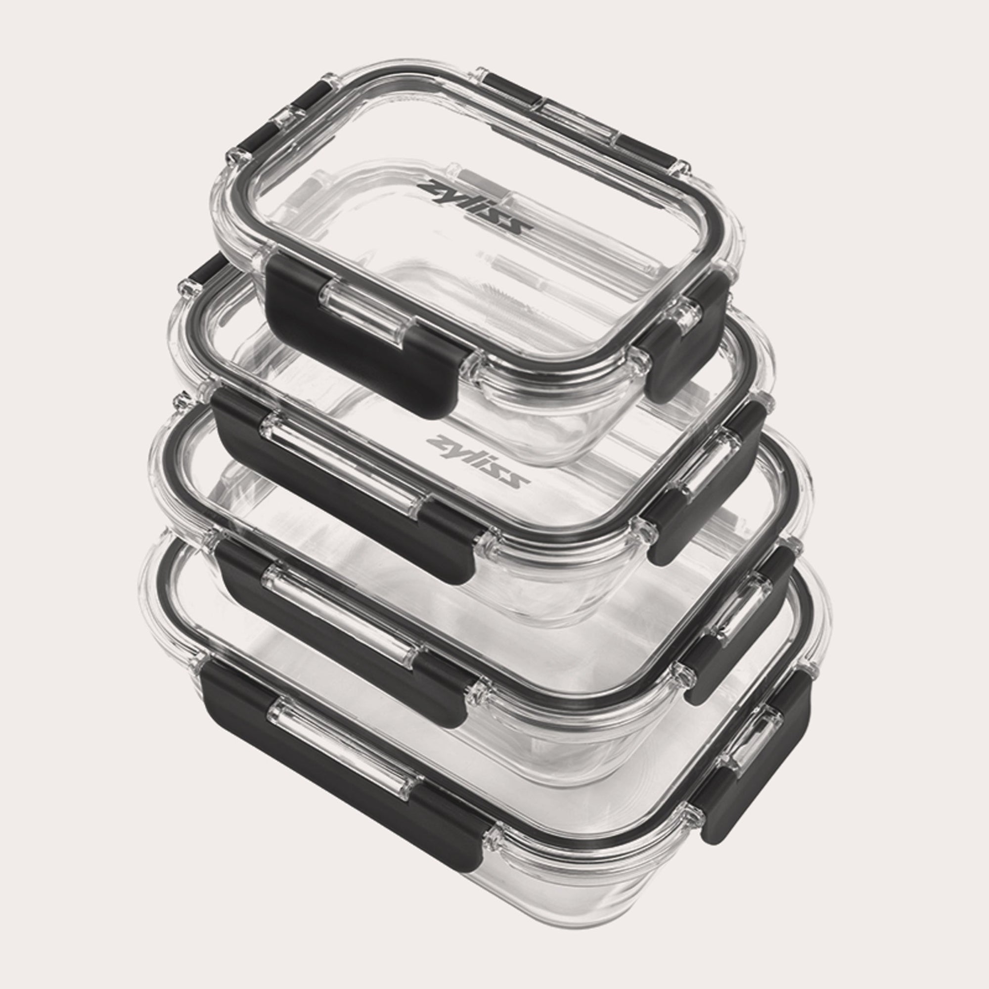 A stack of four clear rectangular glass food containers with black locking lids, arranged neatly on a light background.