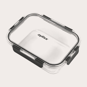 The Zyliss Glass Container features a clear rectangular design, transparent lid with four black locking clips for a secure seal, and the Zyliss logo printed on the lid—ideal for meal prep. #1.52L/1.61qt