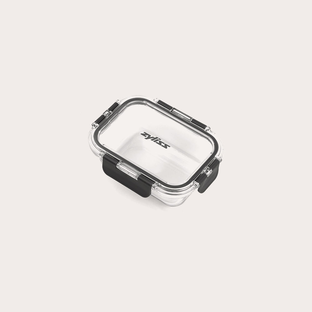 A small, clear rectangular Zyliss Glass Container with a black latch on the front and sides ensures a secure seal. The lid is printed with Zyliss. Shown empty against a white background, its perfect for meal prep. #0.37L/0.39qt