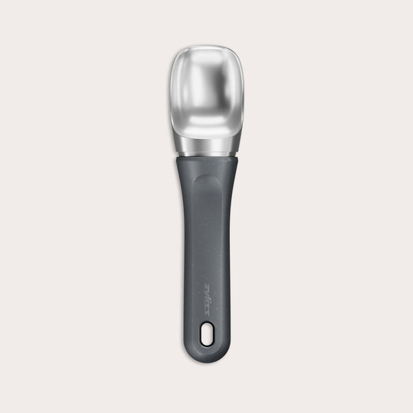 #belugagrey The Zyliss Ice Cream Scoop, featuring a wide deep bowl and eco-friendly handle, is displayed against a plain light background.
