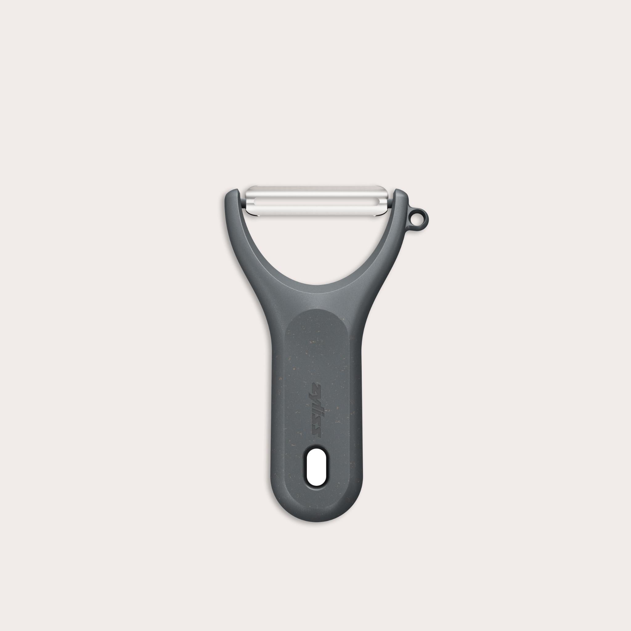 A Zyliss Y Peeler with a stainless steel swivel blade, ergonomic handle, and end hole is shown in black on a plain white background.