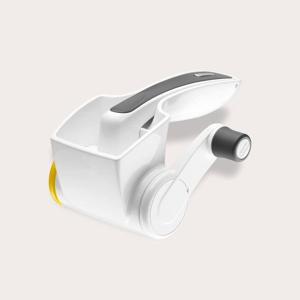 The Zyliss Classic Cheese Grater features a white and gray ergonomic handle, stainless steel drum, crank handle, and cheese compartment for comfortable grating.