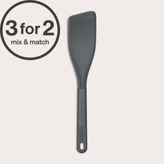The Zyliss Easy Lift Turner—dark gray, heat-resistant silicone with a slanted edge—is shown on a plain background. Ideal for flipping pancakes on non-stick pans. A “3 for 2 mix & match” circular label appears in the top left corner.